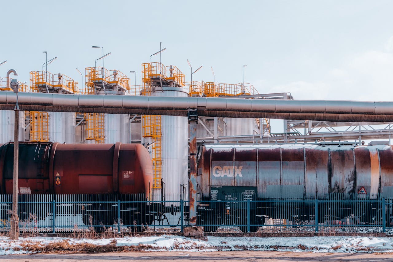 A refinery with industrial train cargo tanks in Trzebinia, Poland on a winter day.